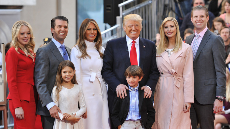 The Trump family posing on stage