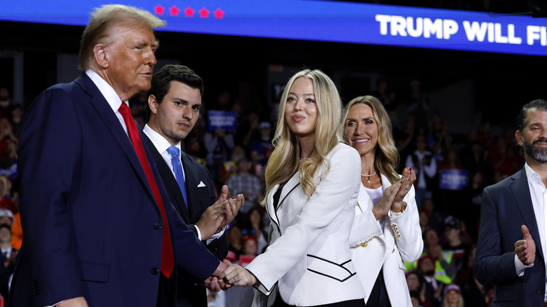 The Trump family standing on stage