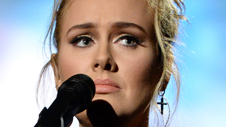 Adele holding microphone