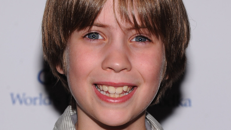 Matthew Mindler smiles at movie premiere in 2011