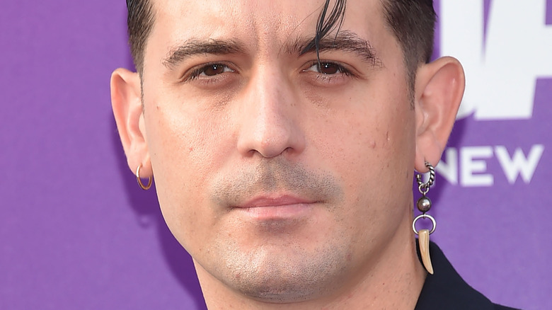 G-Eazy poses with a dangling earring.
