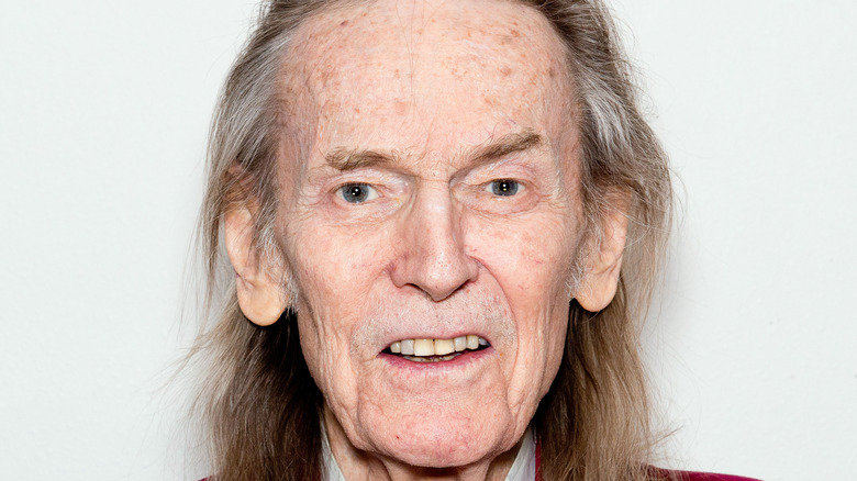 Gordon Lightfoot smiling with long hair