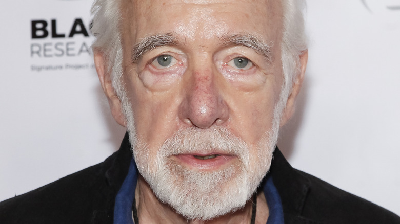 Howard Hesseman looking at camera with serious expression