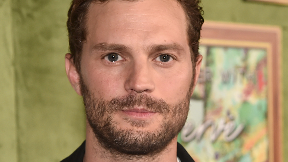 Jamie Dornan posing at an event