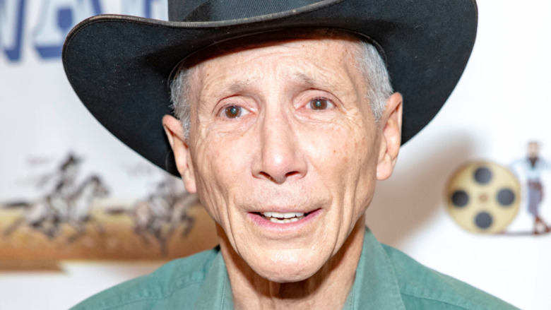 Johnny Crawford with lasso on red carpet 