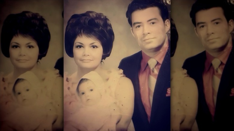 Kimberly Guilfoyle holds her as a baby next to her father