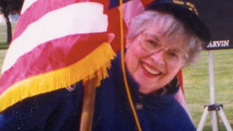 Jo-Carroll Dennison poses with an American flag