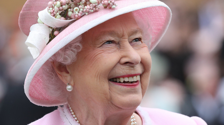 Queen Elizabeth II in pink hat