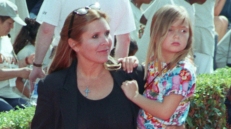 Carrie Fisher holding a young Billie Lourd