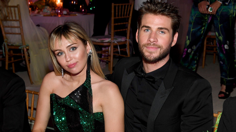 Liam Hemsworth and Miley Cyrus at party