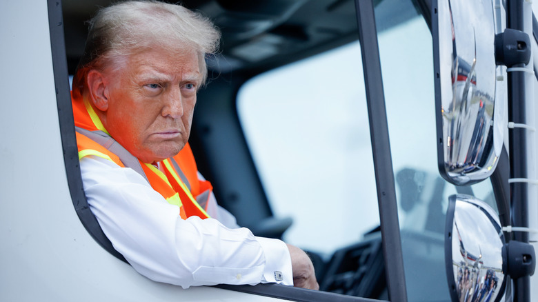 Donald Trump in a garbage truck.