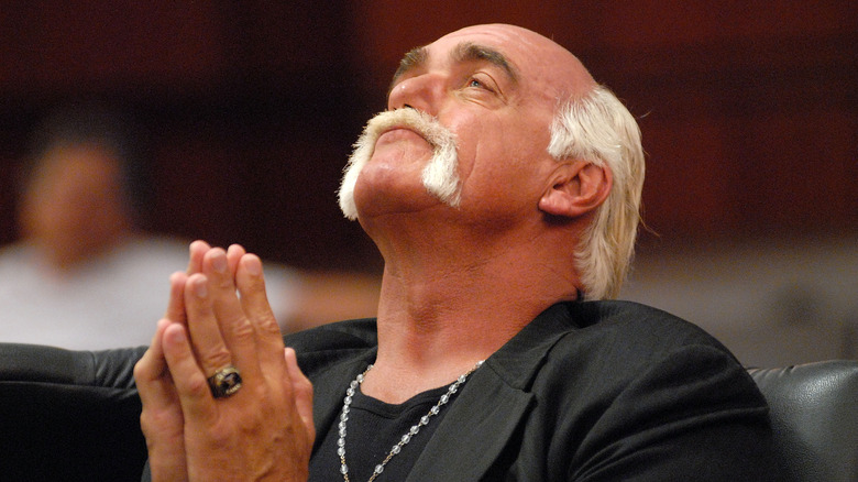 Hulk Hogan tilting his head back while listening to testimony during his divorce trial