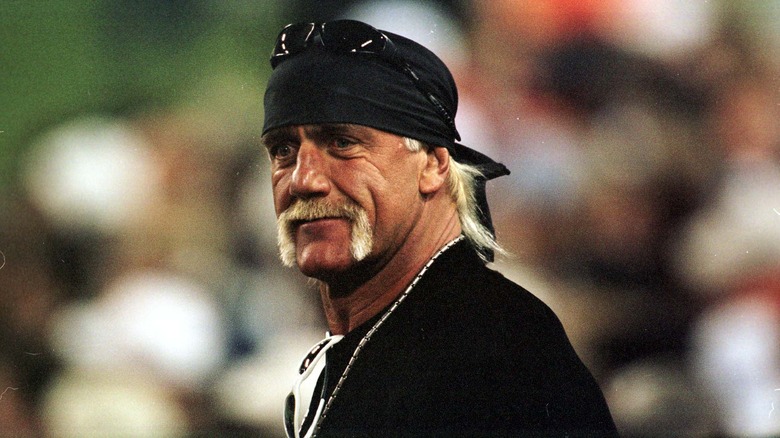 Hulk Hogan with a black headscarf and sunglasses on his head