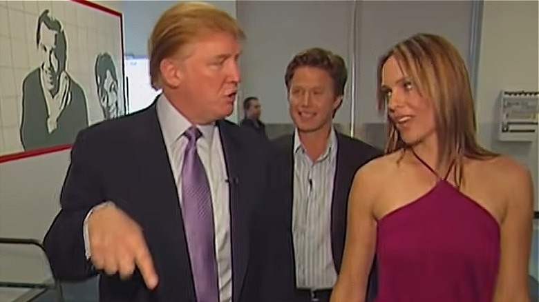 Donald Trump, Billy Bush, and Arianne Zucker walking