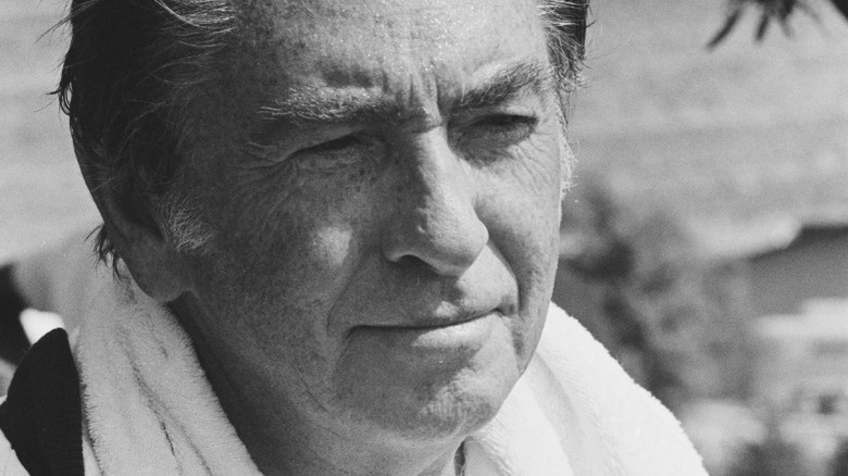 Macdonald Carey with a towel around his neck