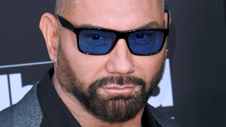 Dave Bautista posing with blue glasses