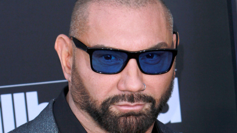 Dave Bautista posing with blue glasses