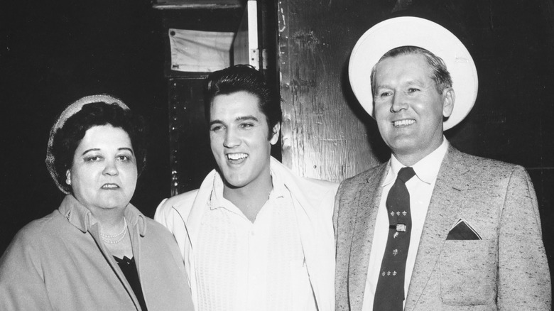 Elvis Presley with his parents 