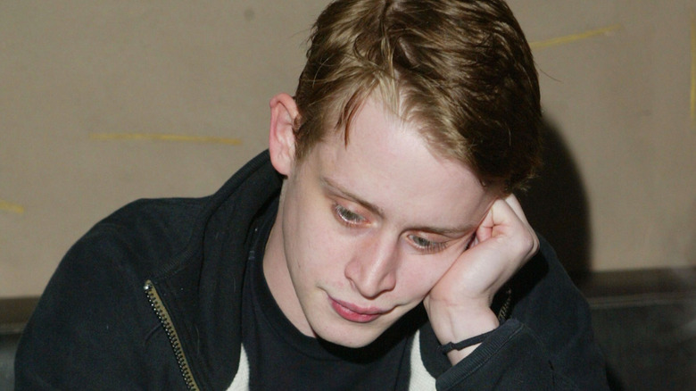 Macaulay Culkin looking pensive