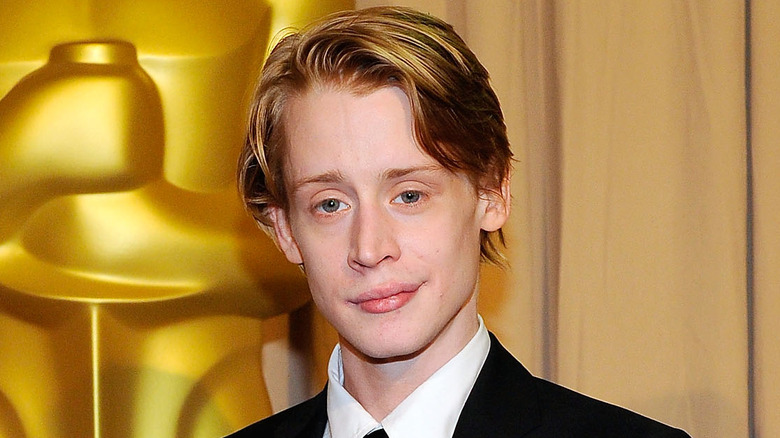 Macaulay Culkin smirking