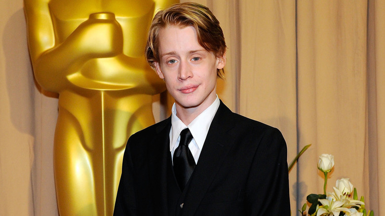 Macaulay Culkin smirking