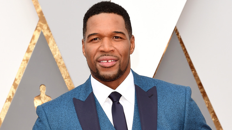 Michael Strahan wearing blue blazer