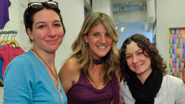 Allison Adler, Paige Tolmach, and actress Sara Gilbert smiling