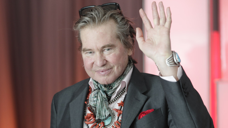 Val Kilmer waving to the camera