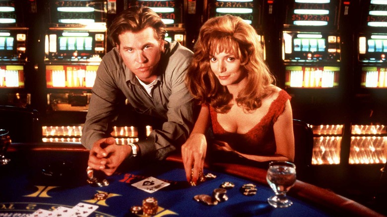Val Kilmer and Joanne Whalley posing in a casino