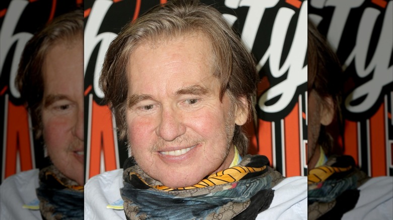 Val Kilmer wearing a scarf
