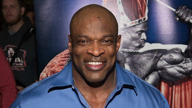 Ronnie Coleman in front of media wall