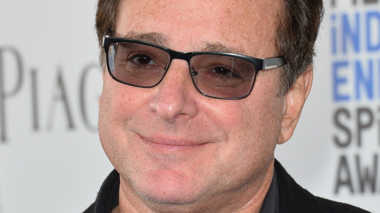 Bob Saget giving a small smile