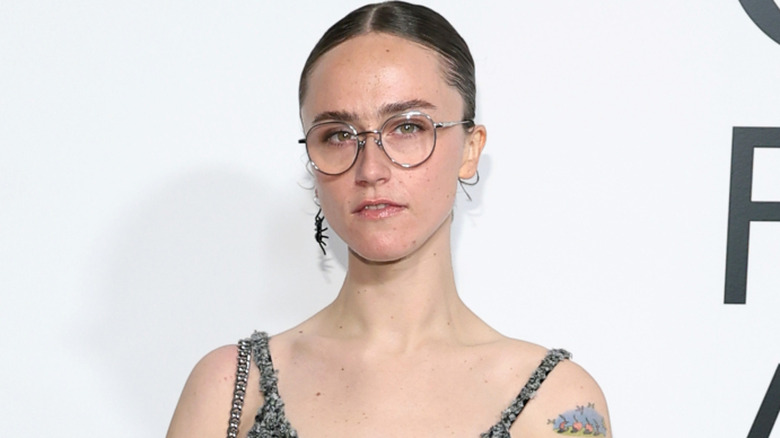 Ella Emhoff poses with glasses and her hair pulled back