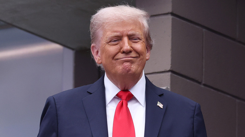 Donald Trump smiling at the U.S. Open