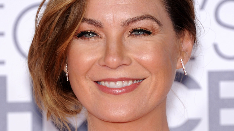 Ellen Pompeo smiles in sparkly earrings