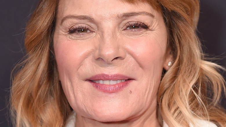 Kim Cattrall smiling tightly