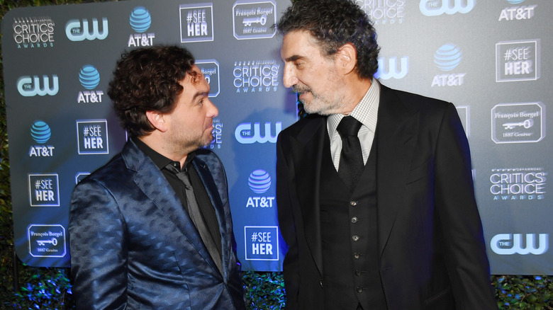 Johnny Galecki and Chuck Lorre talking to each other on the red carpet