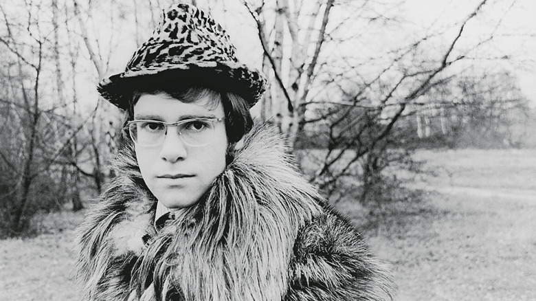 Elton John posing in a hat in 1968