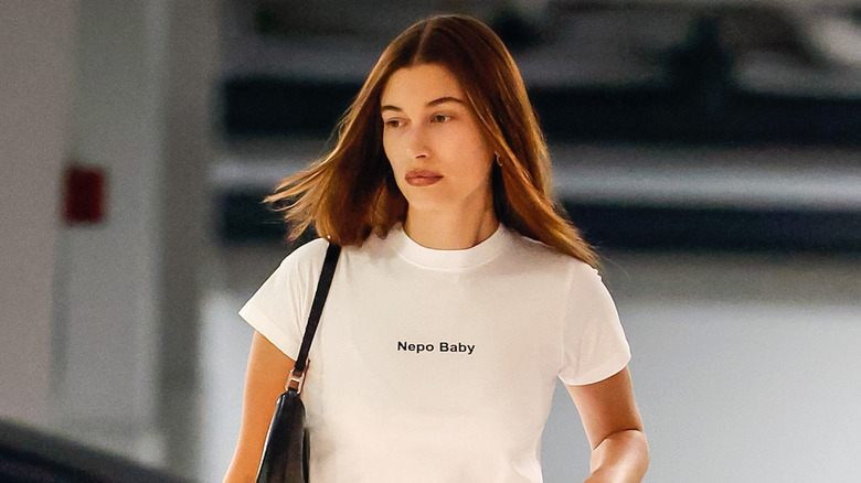Hailey Bieber walking in Nepo Baby t-shirt