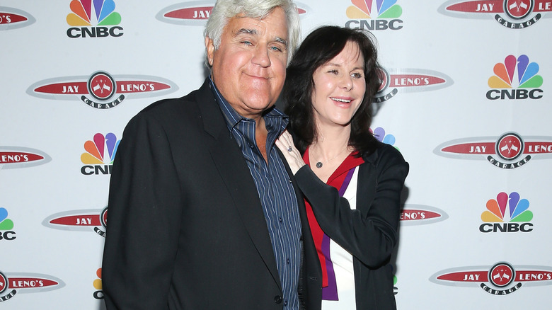 Jay and Mavis Leno posing together on the red carpet.