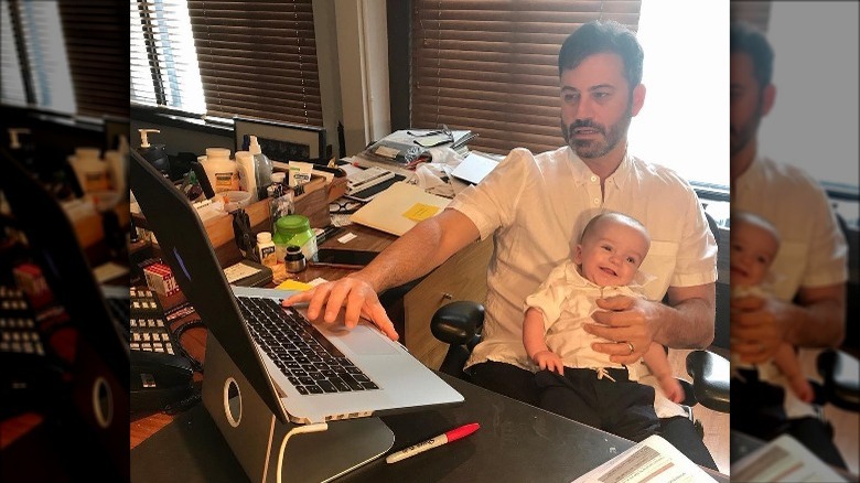 Jimmy Kimmel types with Billy on lap