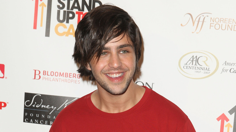 A young Josh Peck smiling at an event