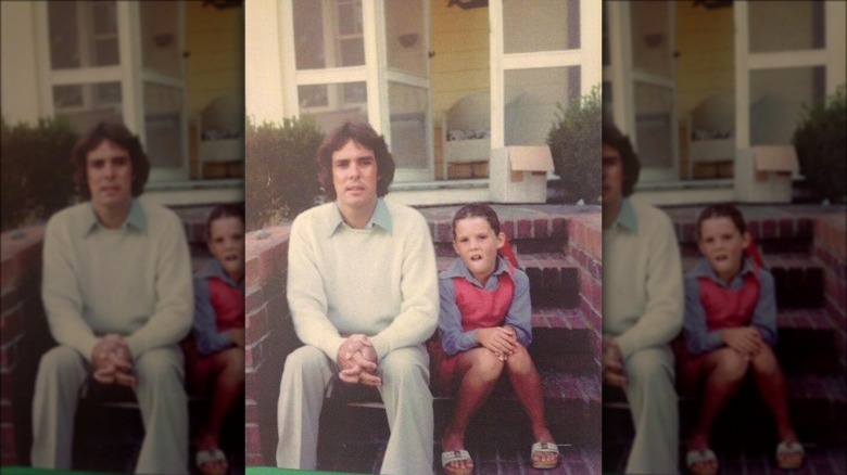 Young Lauren Graham sits with her father