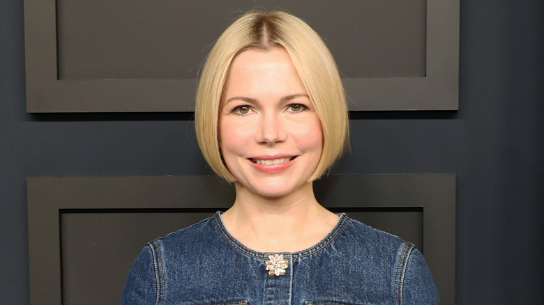 Michelle Williams smiling wearing denim