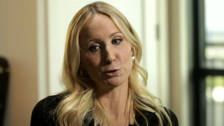 Nikki Glaser looking down and to side