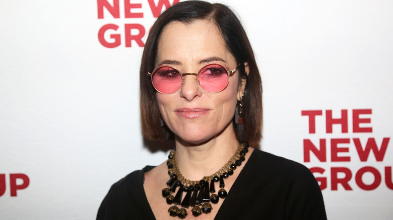 Parker Posey in sunglasses.