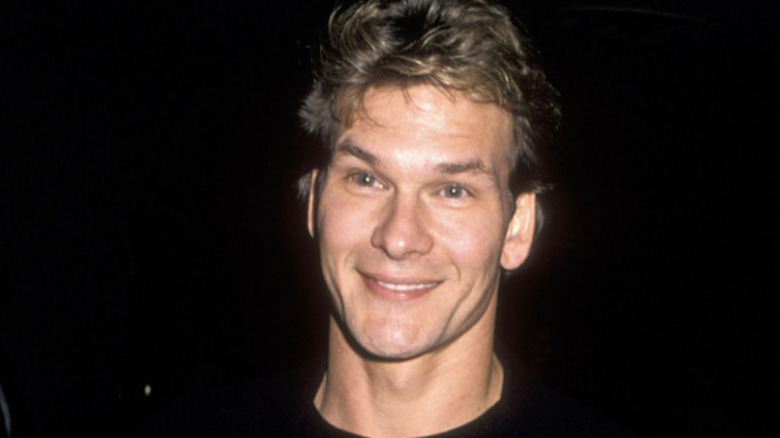 Patrick Swayze posing at an event