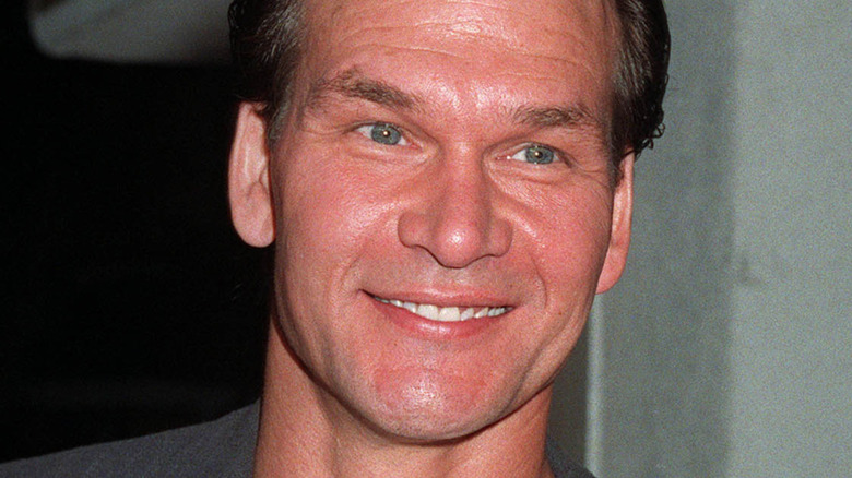 Patrick Swayze posing at an event