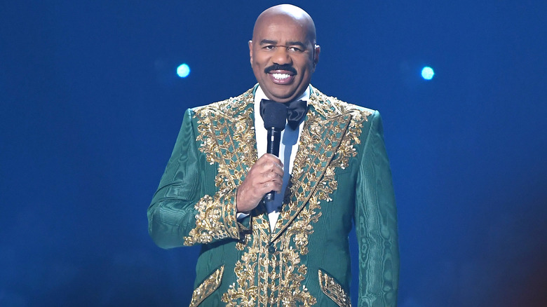 Steve Harvey wearing green