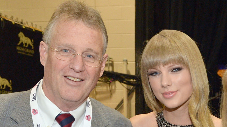Scott and Taylor Swift pose together